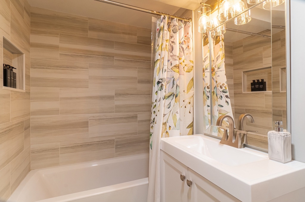 33 Bristow Street, Unit 2 Saugus, MA 01906 - Photo 16 of 21 a bathroom with a sink and a bathtub