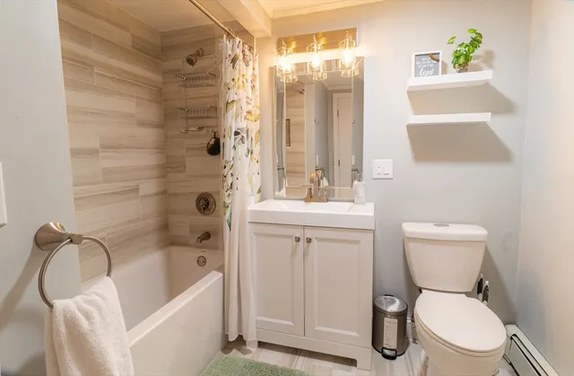 a bathroom with a toilet sink and shower