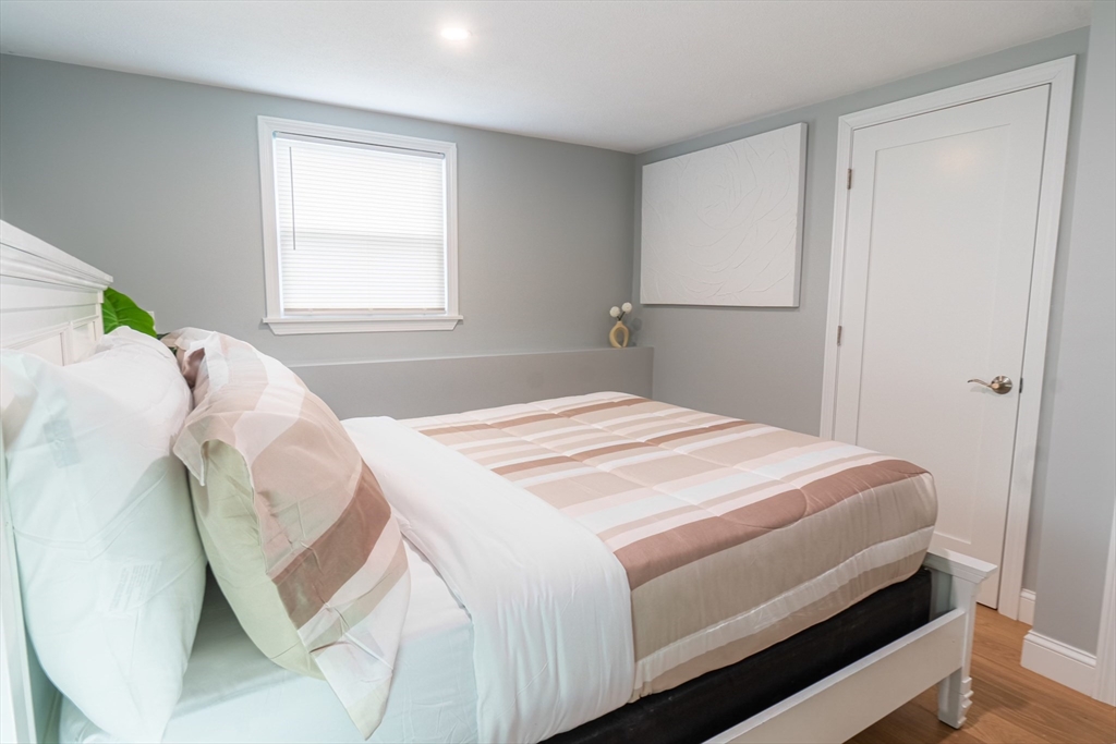 33 Bristow Street, Unit 2 Saugus, MA 01906 - Photo 18 of 21 a bedroom with a bed and a window