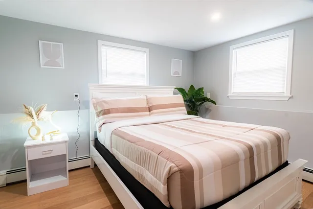 a bedroom with a bed and window