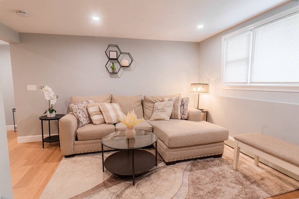 33 Bristow Street, Unit 2 Saugus, MA 01906 - Photo 8 of 21 a living room with furniture and a window