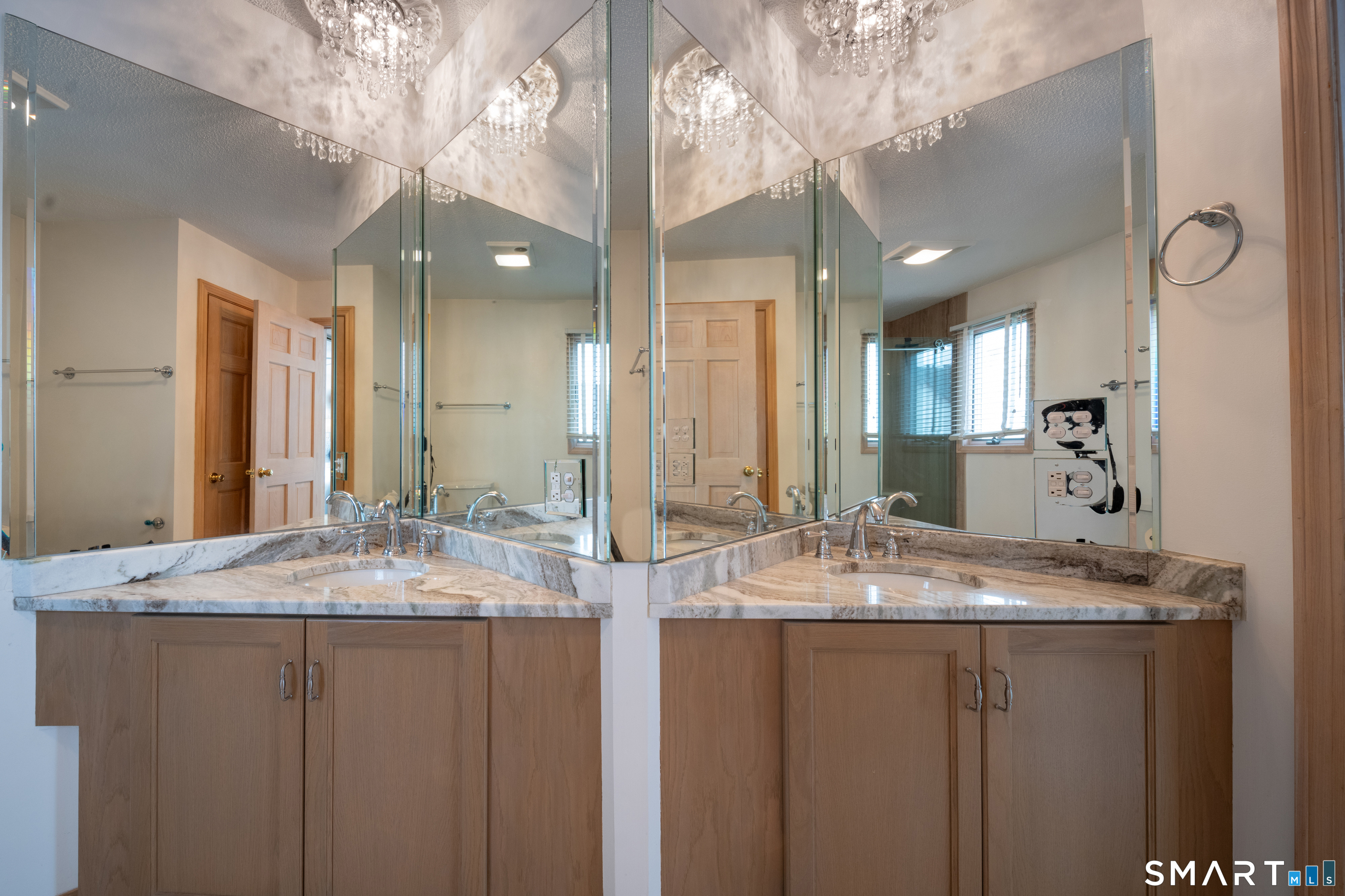 5 A Loop Road, Unit 5A Clinton, CT 06413 - Photo 18 of 37 a bathroom with a granite countertop double vanity and a mirror