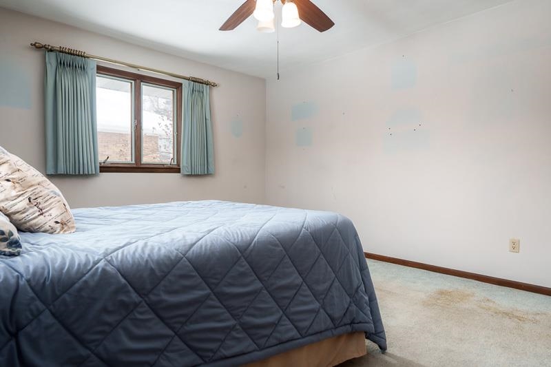 1126 Main Street Pecatonica, IL 61063 - Photo 17 of 40 a bed sitting in a bedroom next to a window