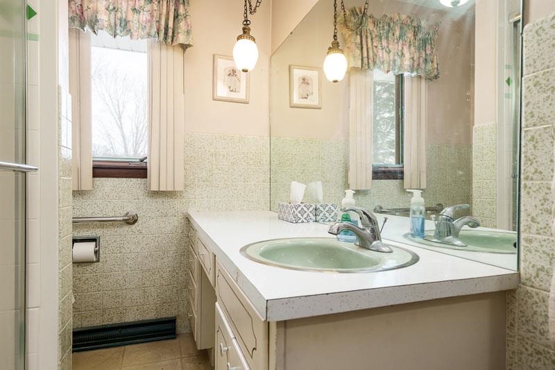 1126 Main Street Pecatonica, IL 61063 - Photo 21 of 40 a bathroom with a sink and a mirror
