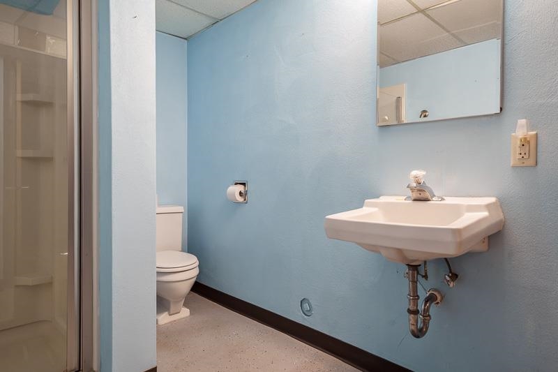 1126 Main Street Pecatonica, IL 61063 - Photo 31 of 40 a bathroom with a sink a toilet and mirror
