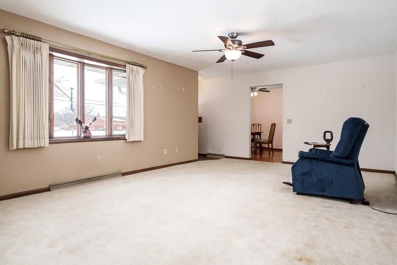 1126 Main Street Pecatonica, IL 61063 - Photo 5 of 40 a living room with furniture and a window