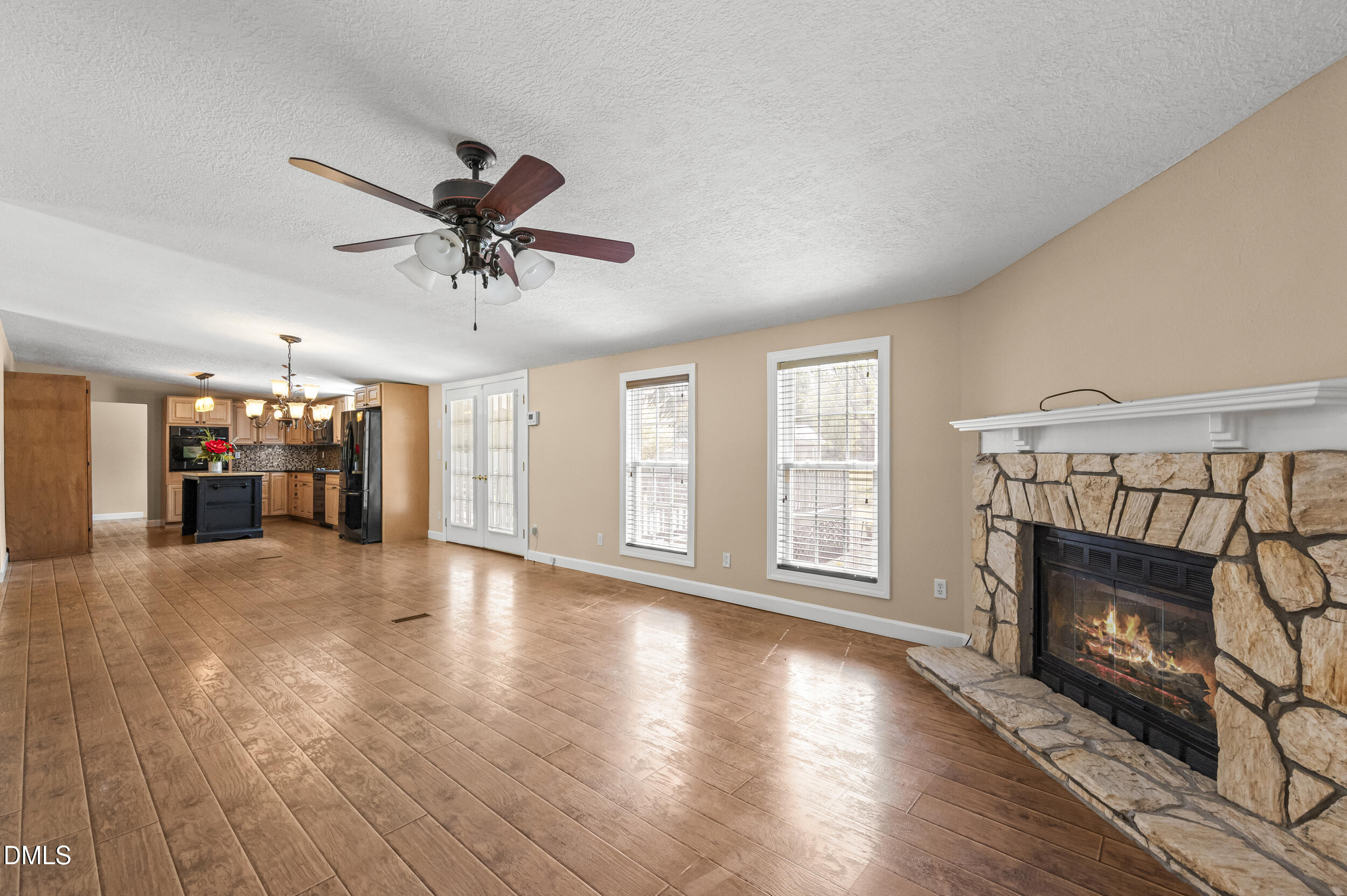 221 Pinkney Church Road Fremont, NC 27830 - Photo 10 of 36 a view of a livingroom with furniture a fireplace and wooden floor