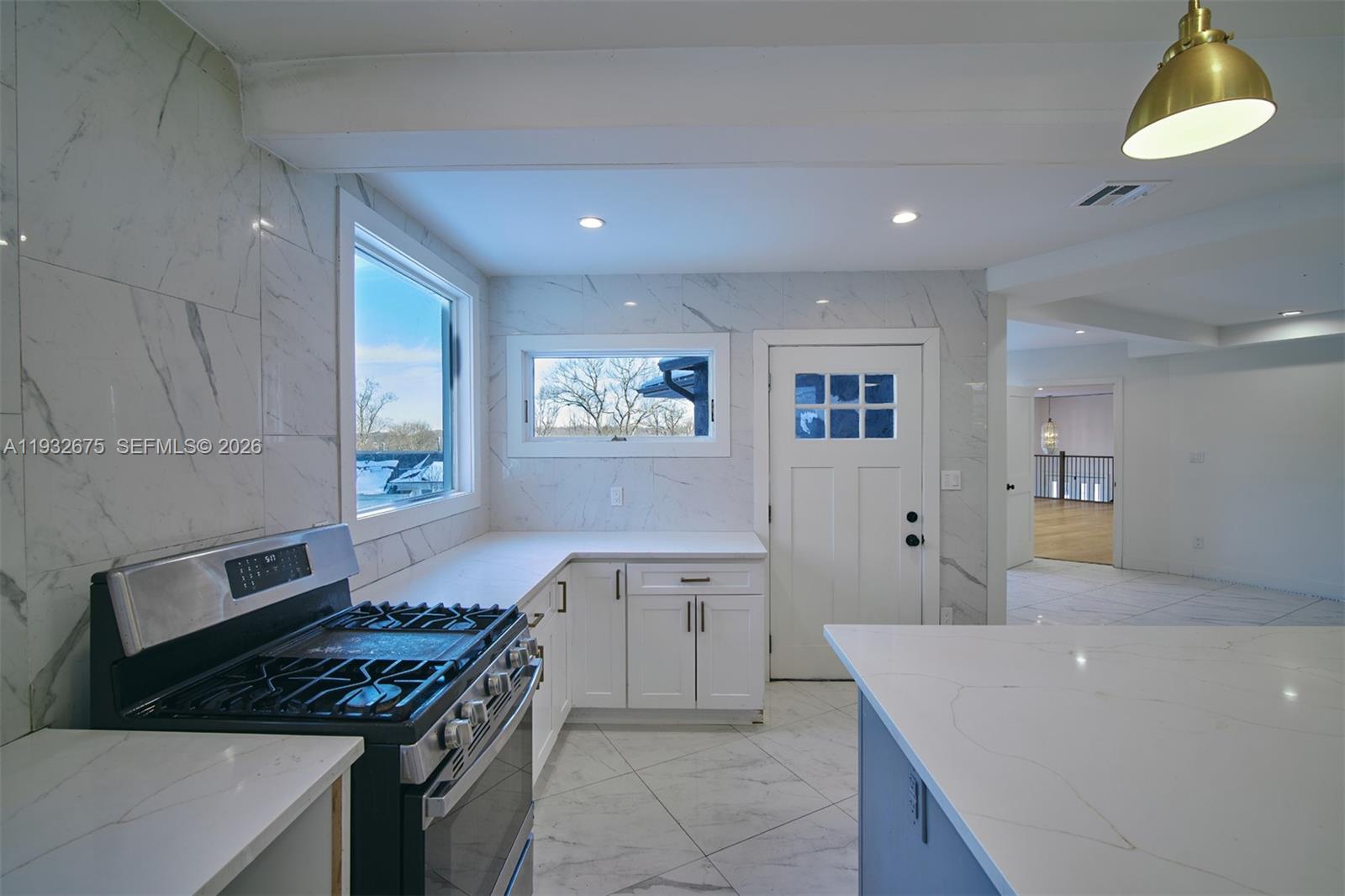 189 McNamara Road Spring Valley, NY 10977 - Photo 11 of 47 a kitchen with a stove and a refrigerator