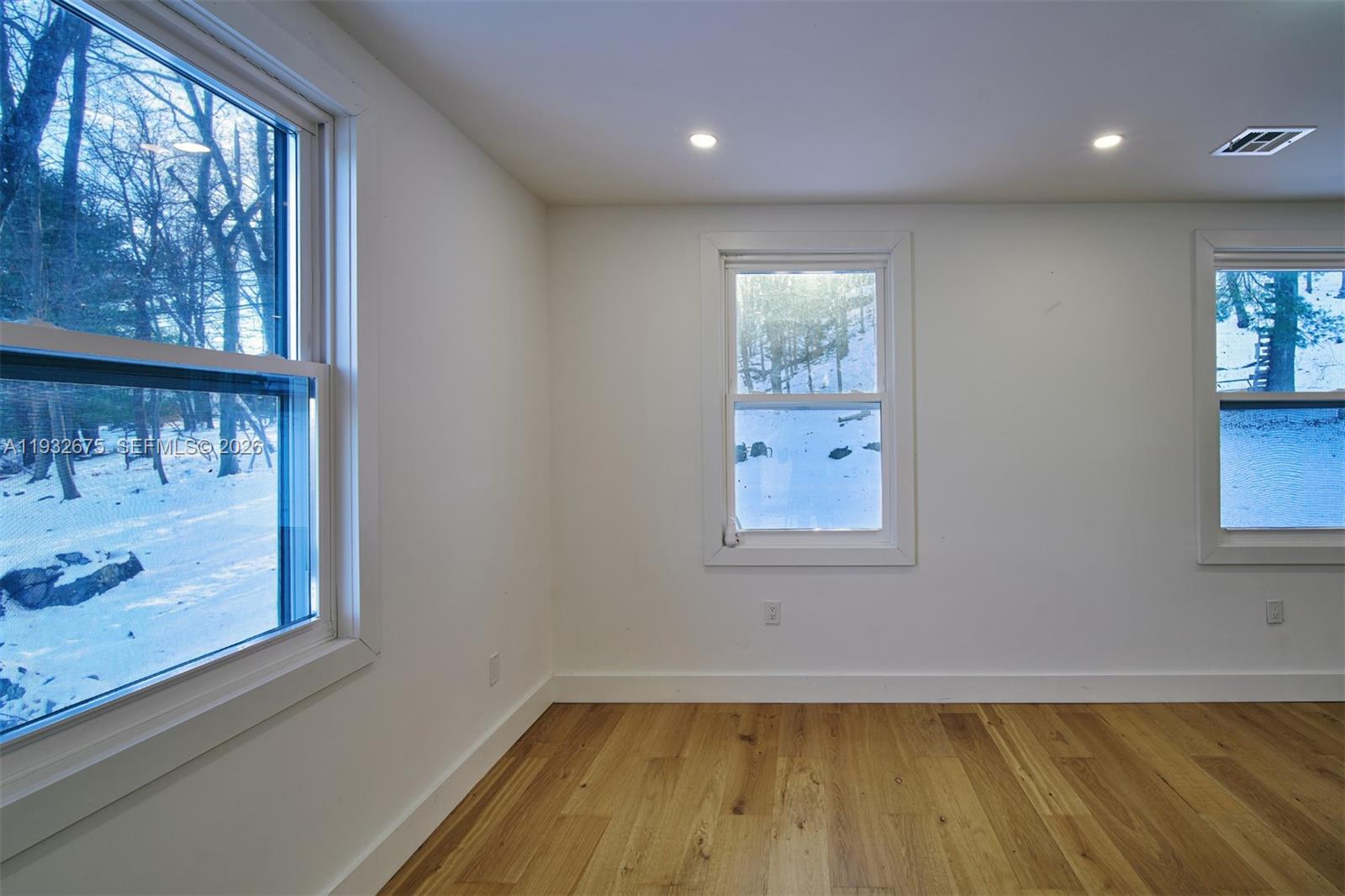189 McNamara Road Spring Valley, NY 10977 - Photo 26 of 47 a view of an empty room with wooden floor and a window
