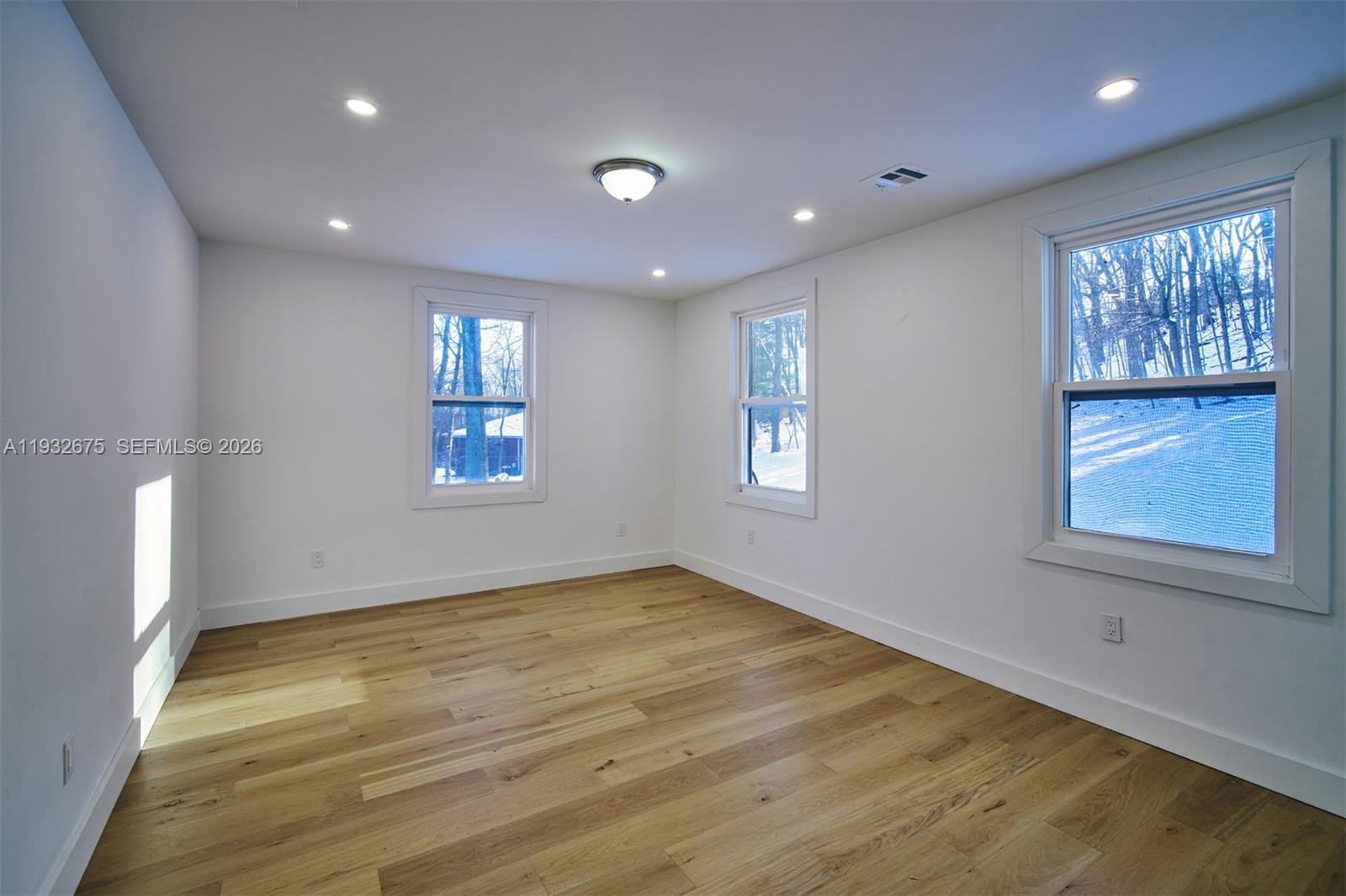 189 McNamara Road Spring Valley, NY 10977 - Photo 27 of 47 a view of empty room with wooden floor and fan