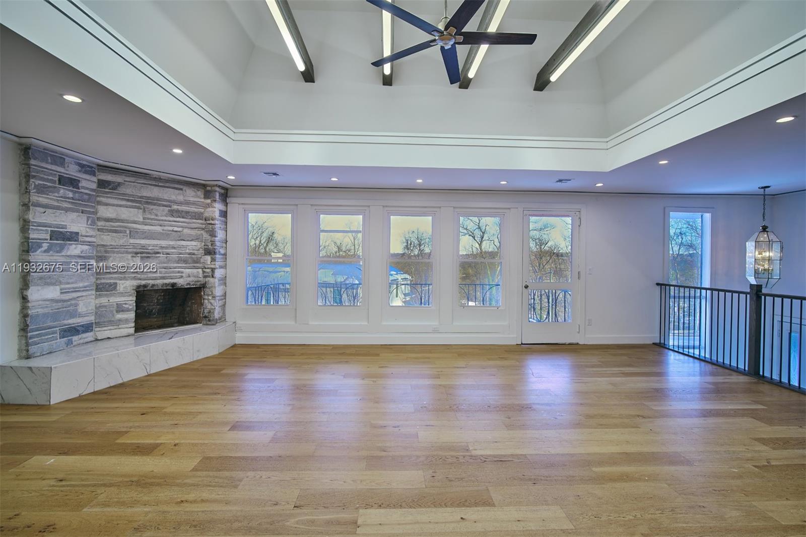 189 McNamara Road Spring Valley, NY 10977 - Photo 3 of 47 a view of empty room with wooden floor and fireplace