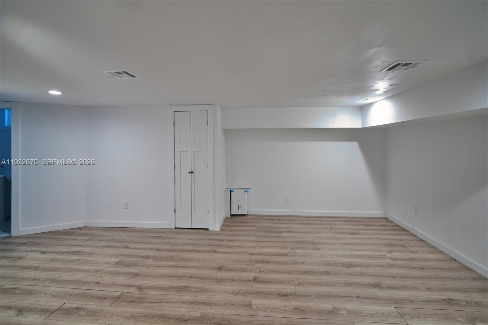 189 McNamara Road Spring Valley, NY 10977 - Photo 32 of 47 a view of an empty room with wooden floor