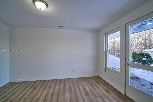 a bathroom with a sink toilet and a mirror