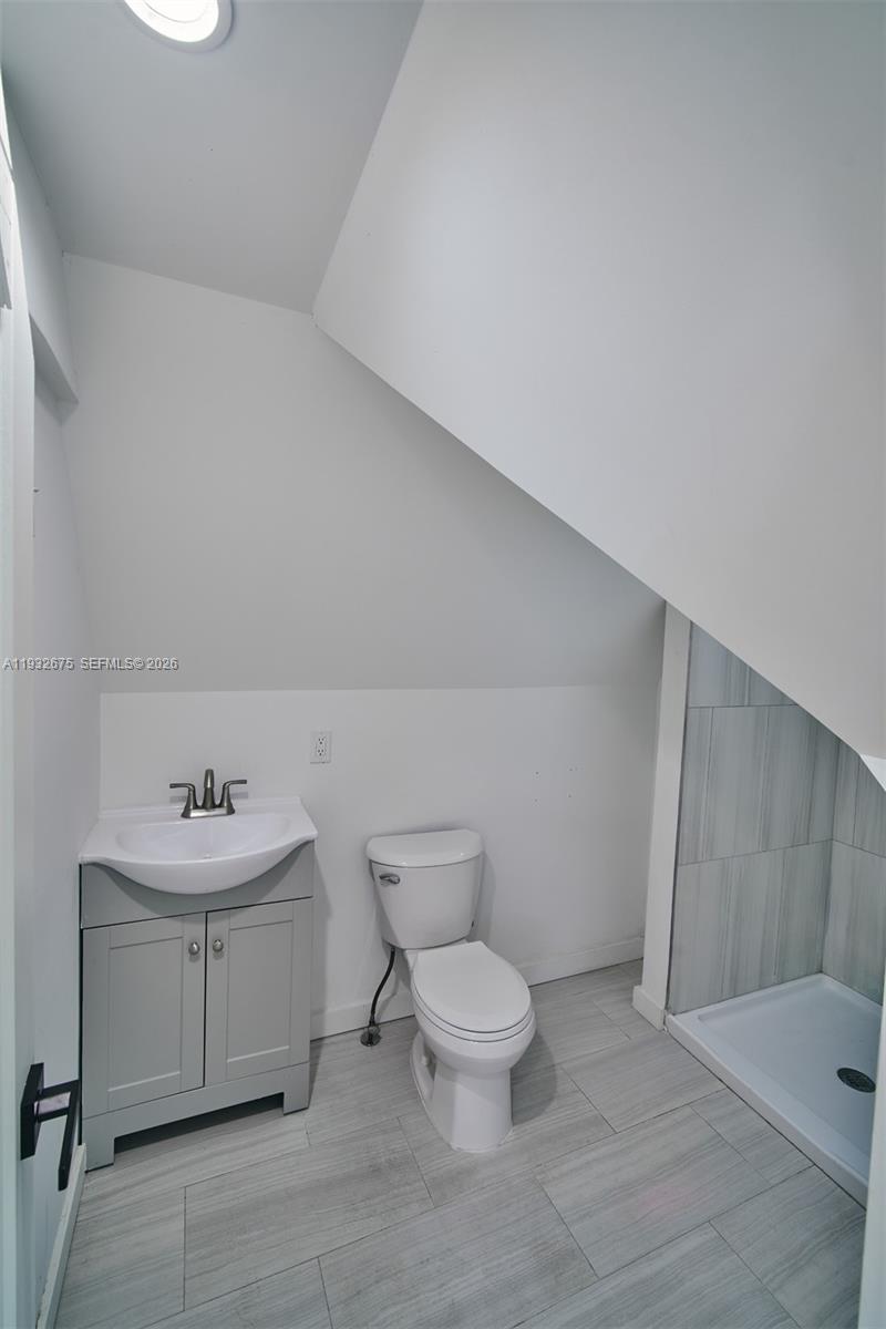 189 McNamara Road Spring Valley, NY 10977 - Photo 38 of 47 a bathroom with a sink toilet and a mirror