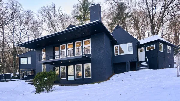 a front view of a house with a yard