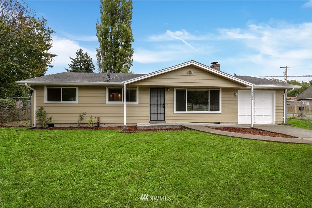 34660 Military Road South Federal Way, WA 98001 - Photo 1 of 24 a front view of a house with a garden