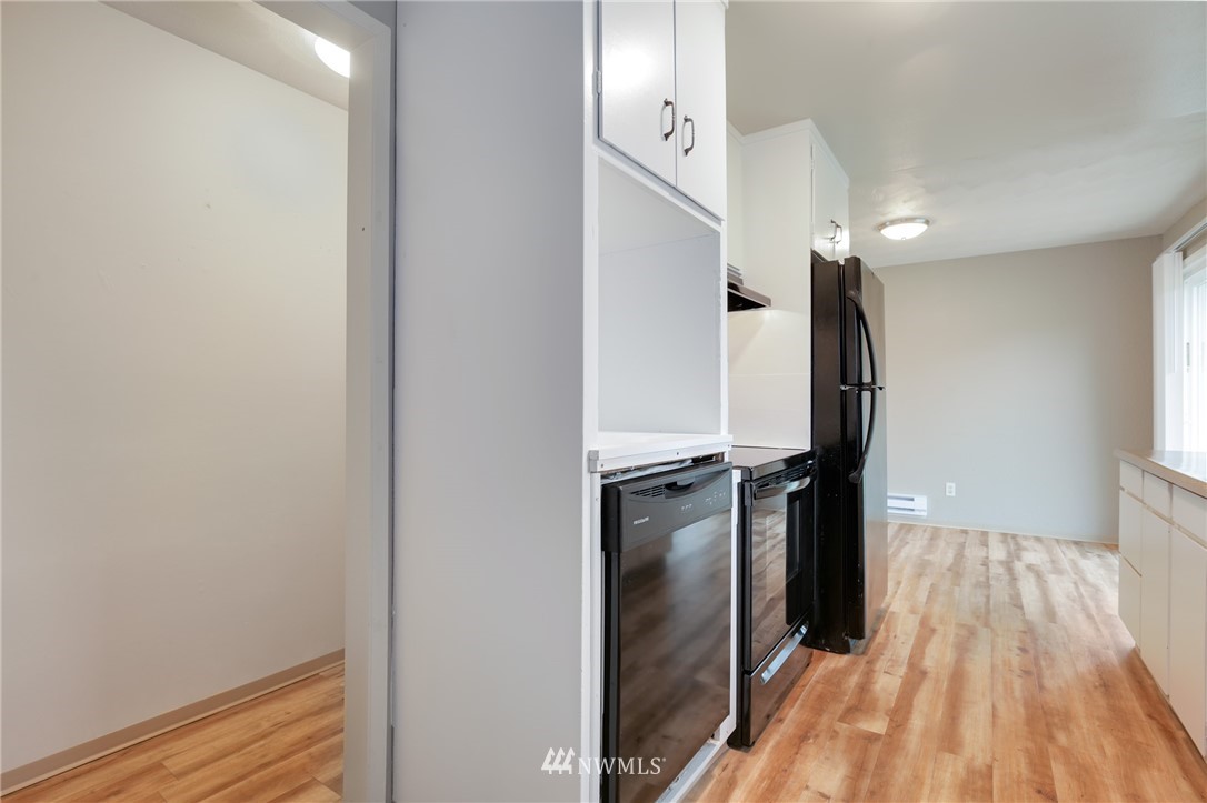 34660 Military Road South Federal Way, WA 98001 - Photo 11 of 24 a view of a kitchen with a refrigerator and a window