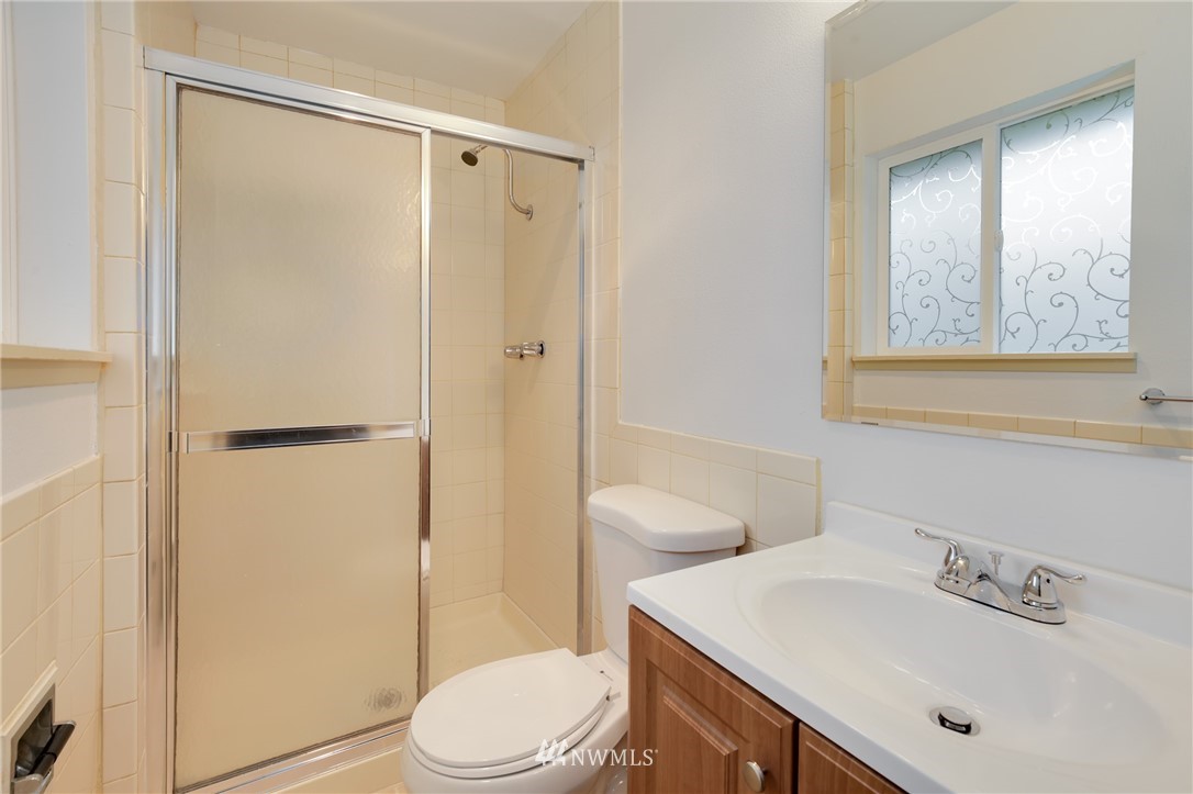 34660 Military Road South Federal Way, WA 98001 - Photo 15 of 24 a bathroom with a sink a toilet and shower