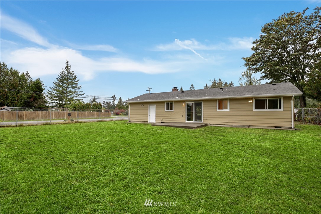 34660 Military Road South Federal Way, WA 98001 - Photo 22 of 24 a view of a yard in front of a house with large trees