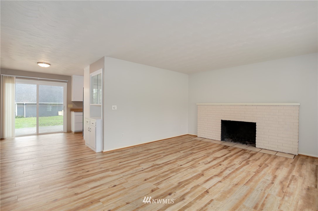 34660 Military Road South Federal Way, WA 98001 - Photo 4 of 24 wooden floor fireplace and natural light in room