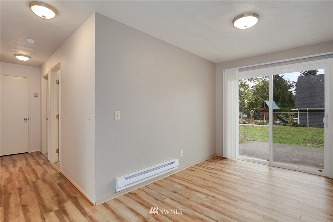 34660 Military Road South Federal Way, WA 98001 - Photo 6 of 24 wooden floor in an empty room with a window