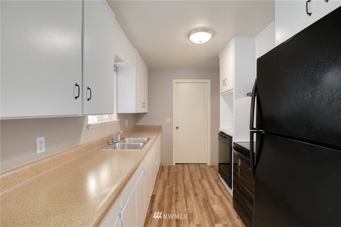 34660 Military Road South Federal Way, WA 98001 - Photo 8 of 24 a kitchen with a refrigerator and a sink