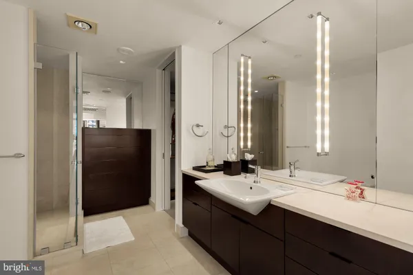 a bedroom with a bed couch and a table