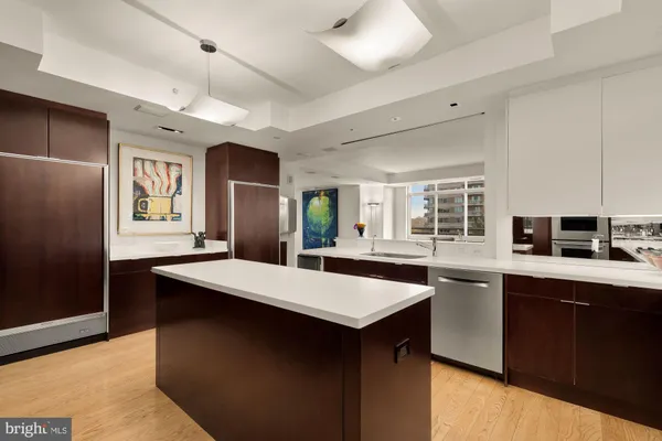 a kitchen with a sink a stove and refrigerator
