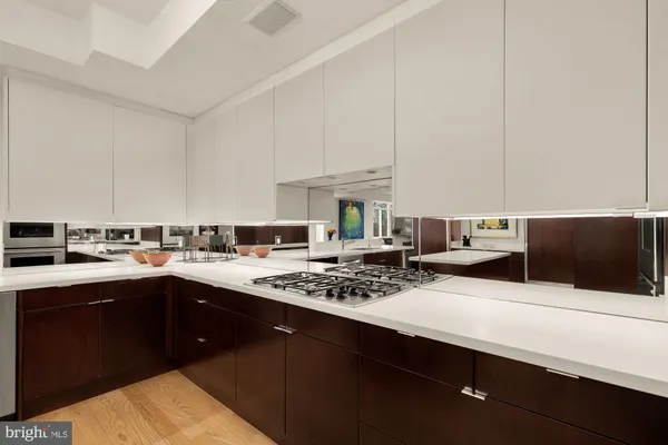 a kitchen with sink and cabinets
