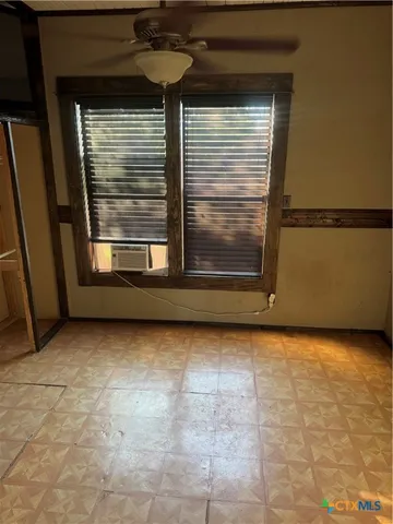 a view of a room that has a window in it