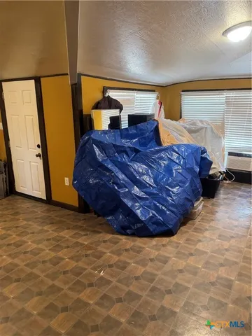 a living room with a bed