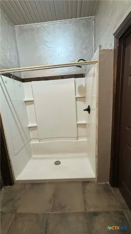 a view of a living room hardwood floor and a ceiling fan