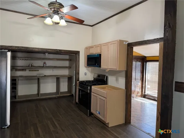 an empty room with wooden floor