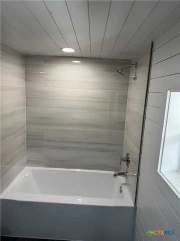 a bathroom with a bathtub