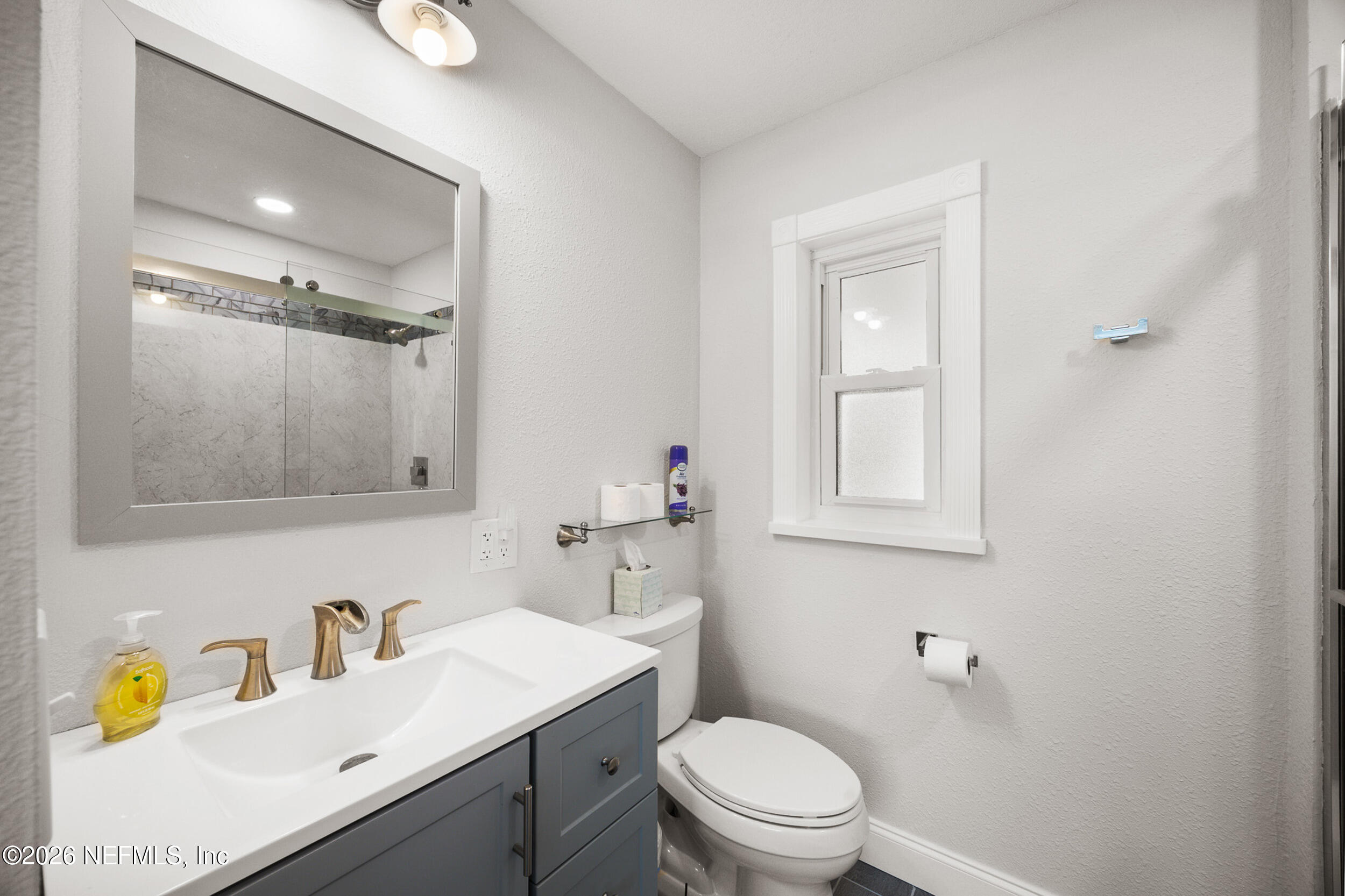 17 Palm Drive Yankeetown, FL 34498 - Photo 14 of 45 a bathroom with a sink vanity mirror and toilet