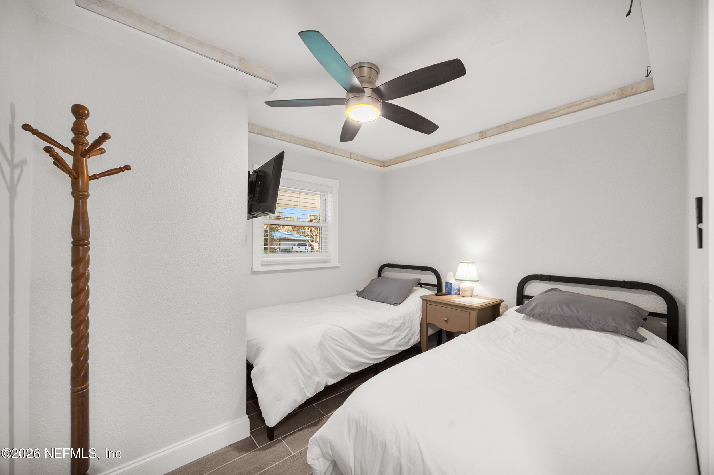 17 Palm Drive Yankeetown, FL 34498 - Photo 20 of 45 a bedroom with two bed and a ceiling fan