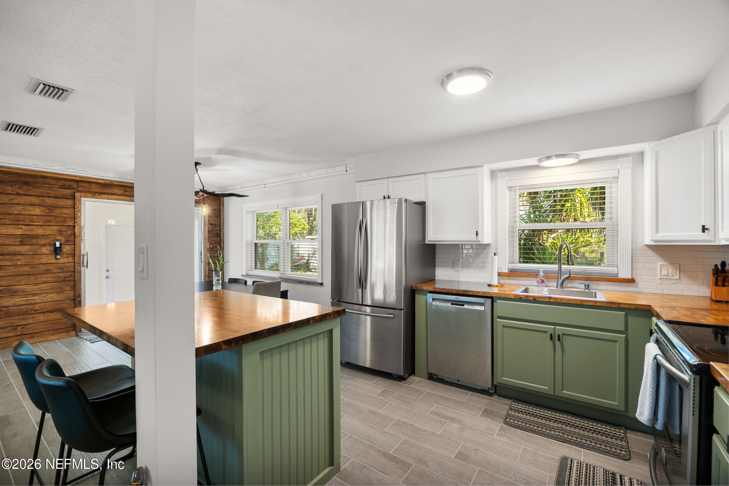 17 Palm Drive Yankeetown, FL 34498 - Photo 2 of 45 a kitchen with kitchen island a sink table and chairs