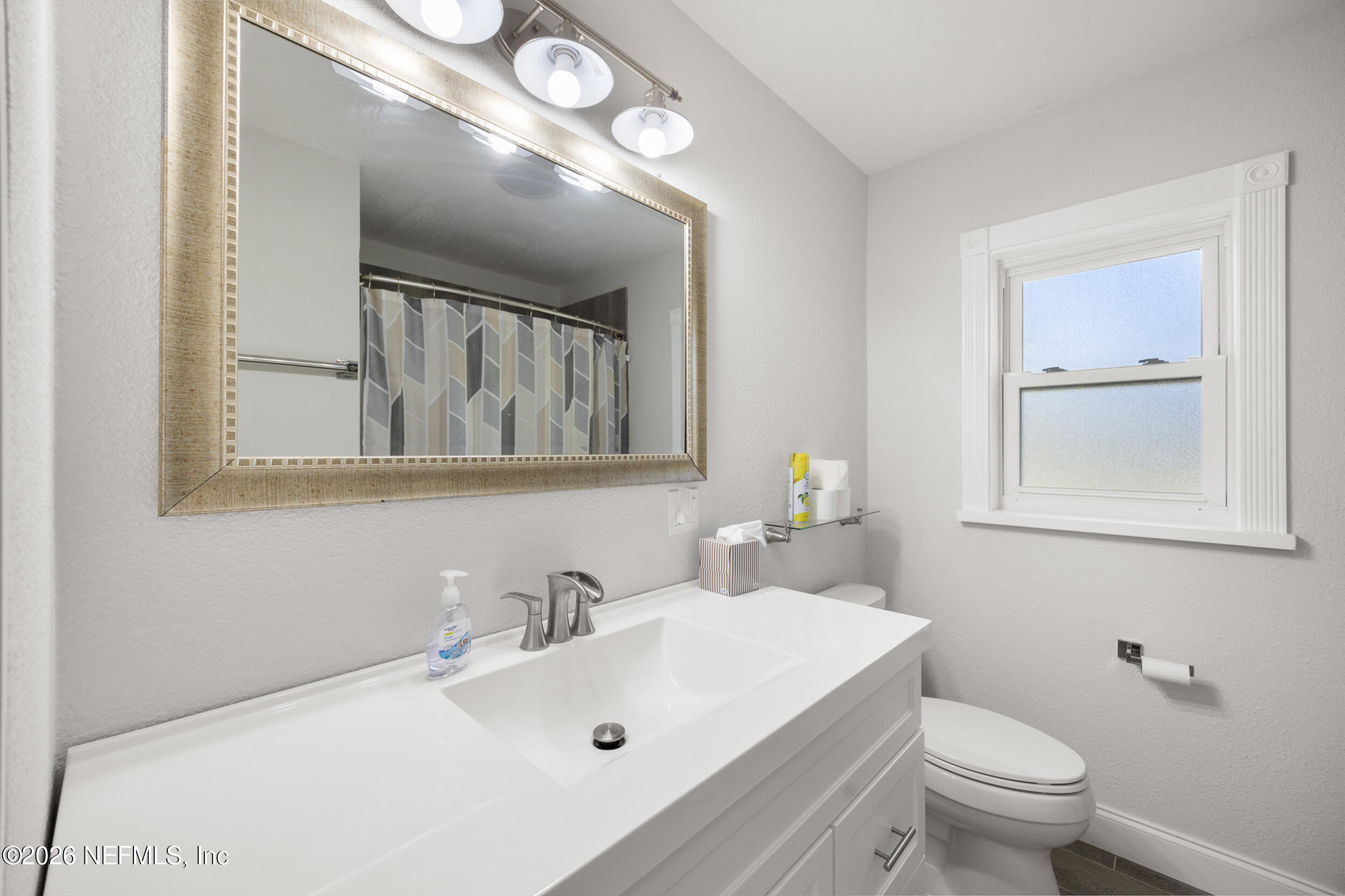 17 Palm Drive Yankeetown, FL 34498 - Photo 21 of 45 a bathroom with a sink and a mirror