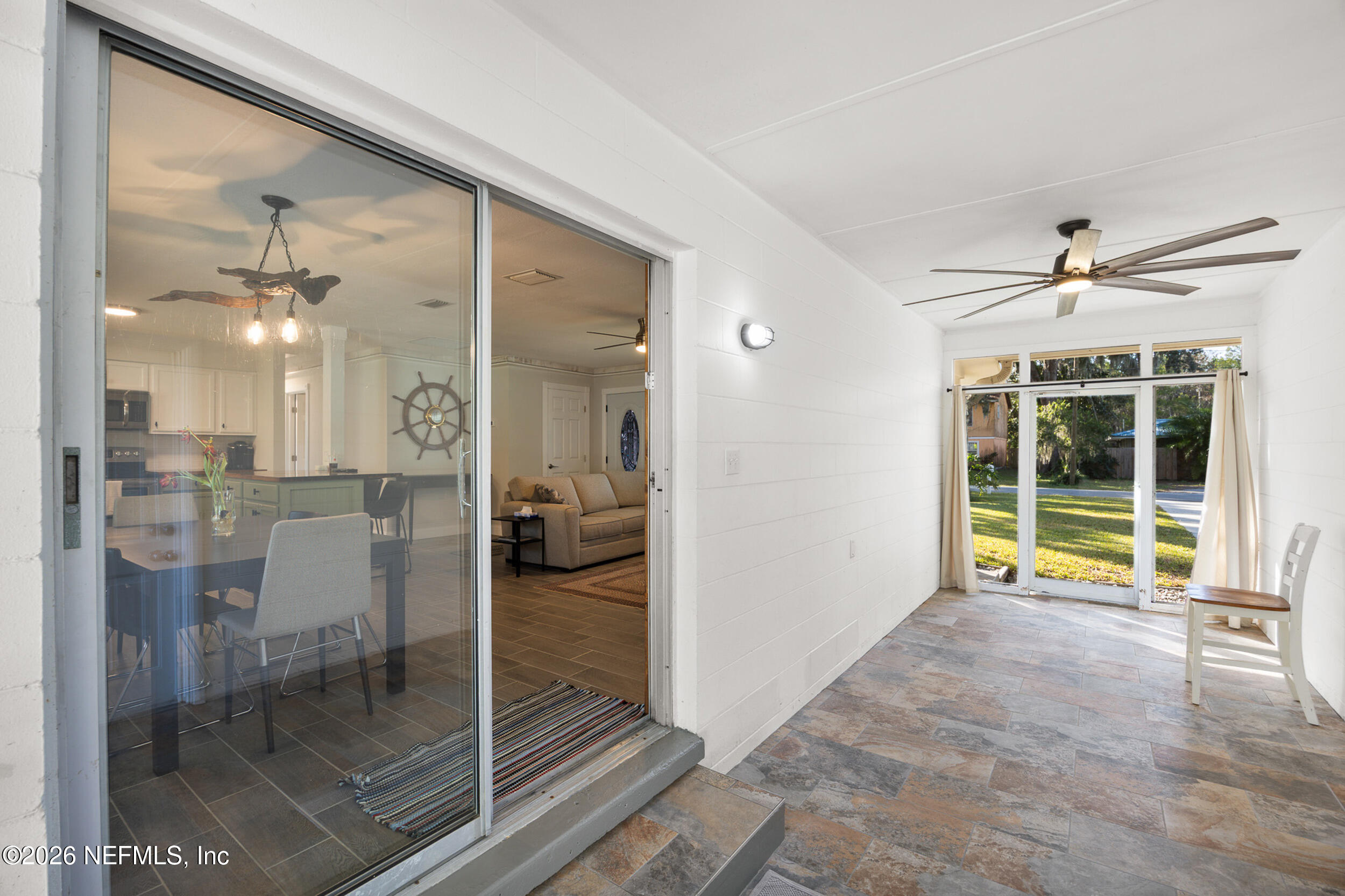 17 Palm Drive Yankeetown, FL 34498 - Photo 23 of 45 a view of a livingroom with a flat screen tv and outdoor view