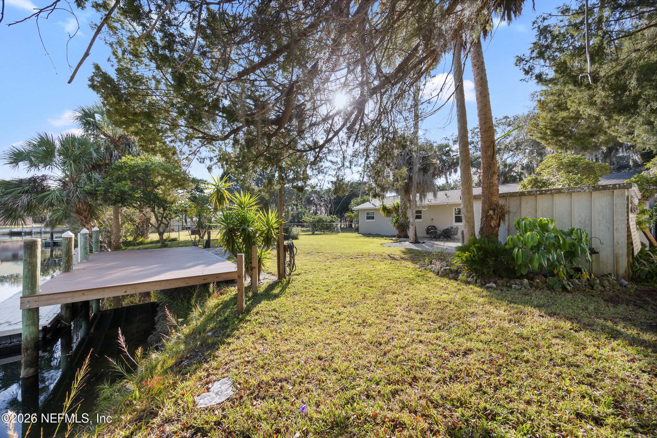 17 Palm Drive Yankeetown, FL 34498 - Photo 31 of 45 a view of a backyard with plants and large trees