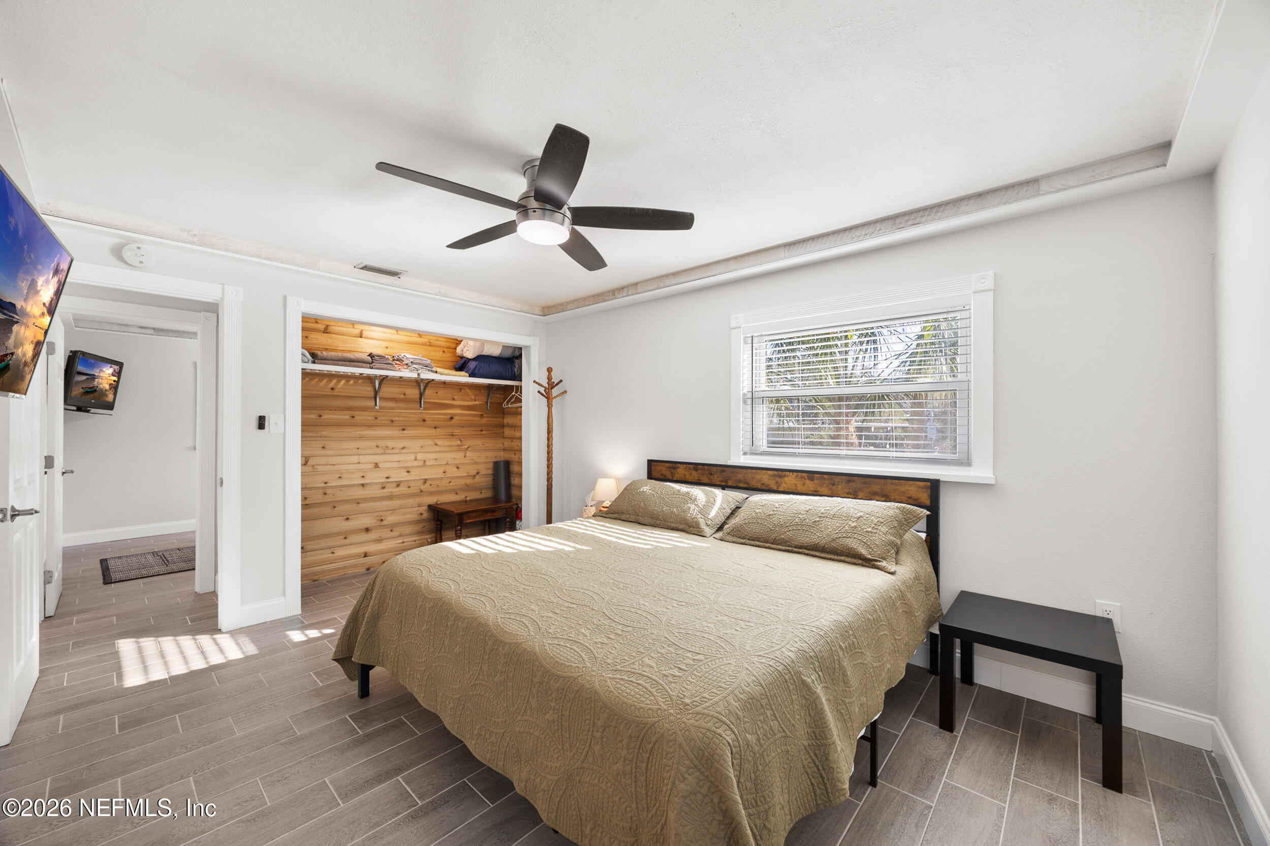 17 Palm Drive Yankeetown, FL 34498 - Photo 4 of 45 a bedroom with a bed and a window