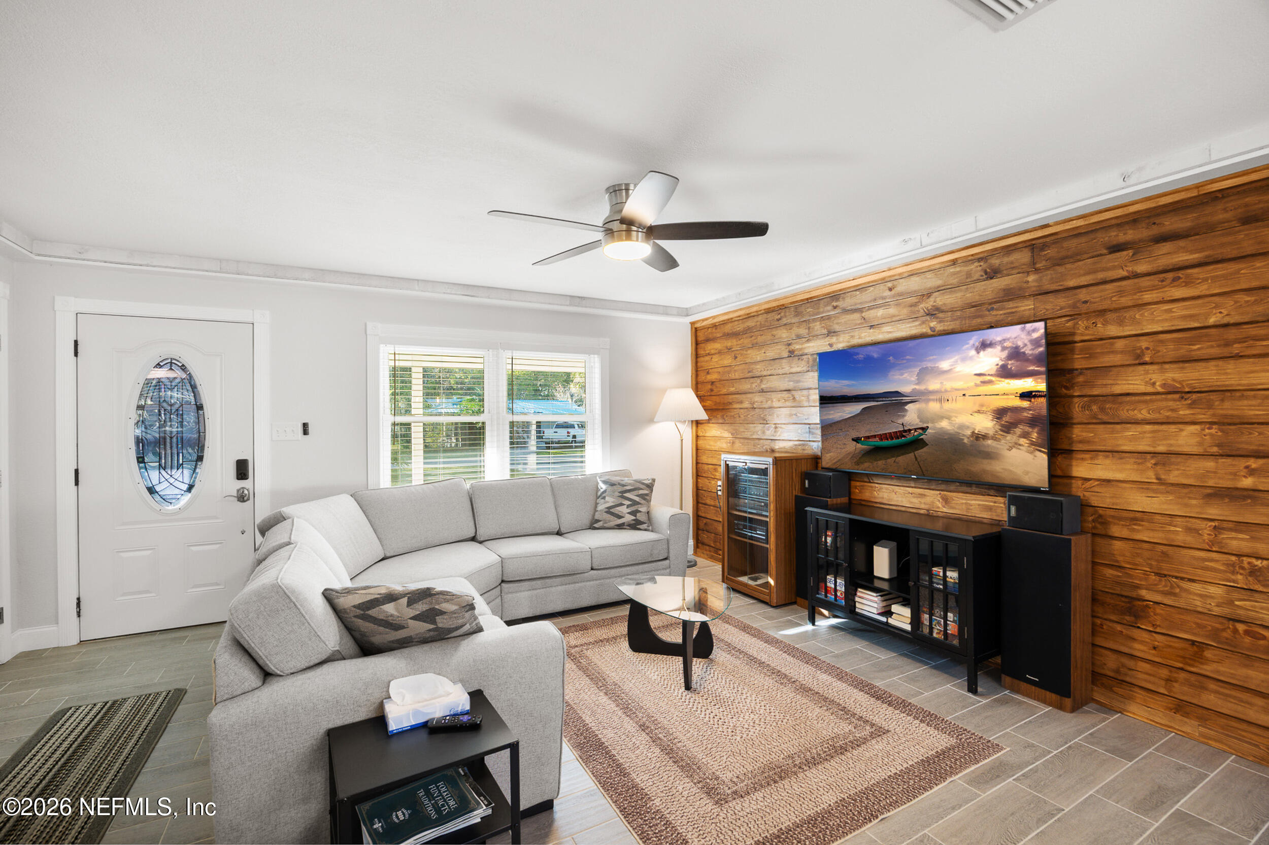 17 Palm Drive Yankeetown, FL 34498 - Photo 7 of 45 a living room with furniture and a flat screen tv