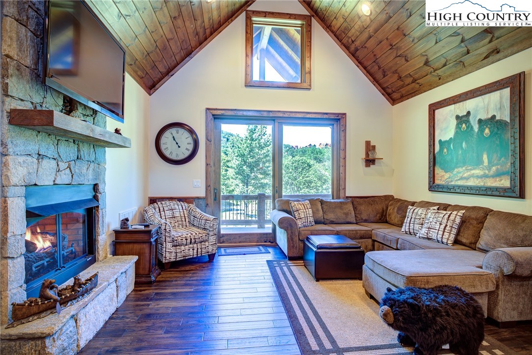 242 Camp Eagle Loop Banner Elk, NC 28604 - Photo 12 of 25 a living room with furniture and a fireplace