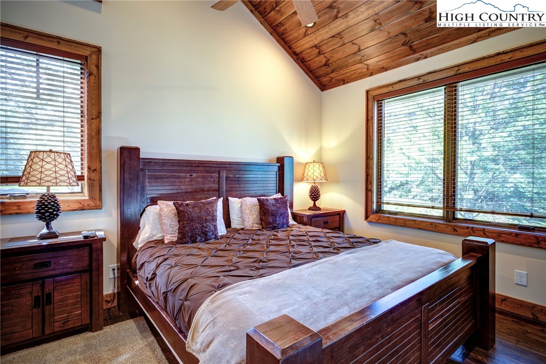 242 Camp Eagle Loop Banner Elk, NC 28604 - Photo 15 of 25 a bedroom with a large bed and a window