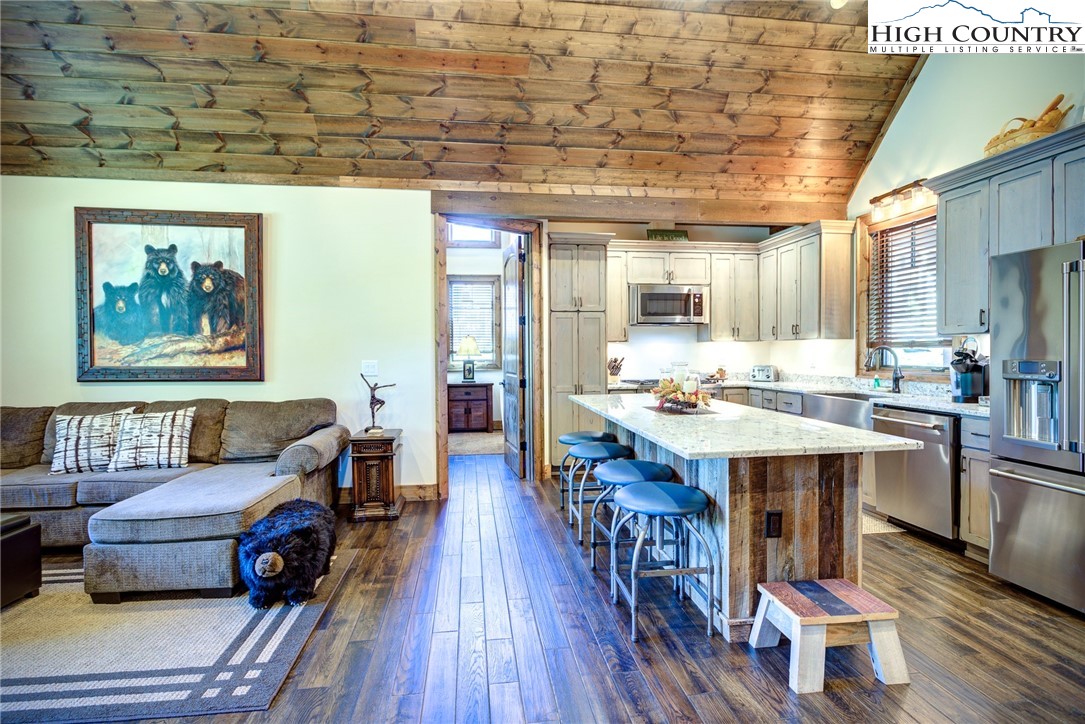 242 Camp Eagle Loop Banner Elk, NC 28604 - Photo 18 of 25 a living room with furniture and wooden floor