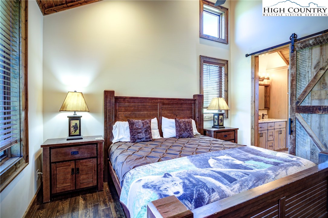 242 Camp Eagle Loop Banner Elk, NC 28604 - Photo 20 of 25 a bedroom with a bed and a night stand