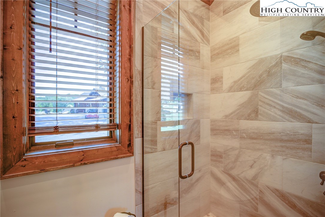 242 Camp Eagle Loop Banner Elk, NC 28604 - Photo 22 of 25 a bathroom with a shower