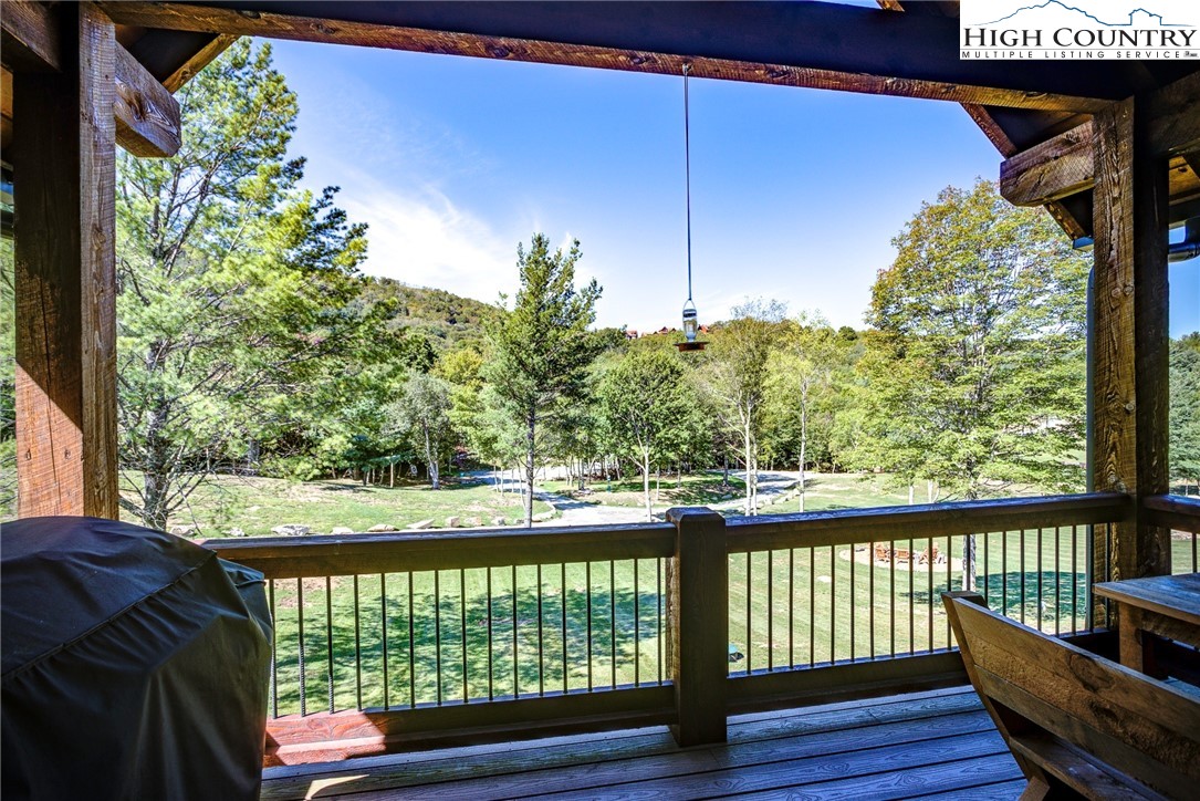 242 Camp Eagle Loop Banner Elk, NC 28604 - Photo 23 of 25 a view of a balcony with wooden floor and outdoor space