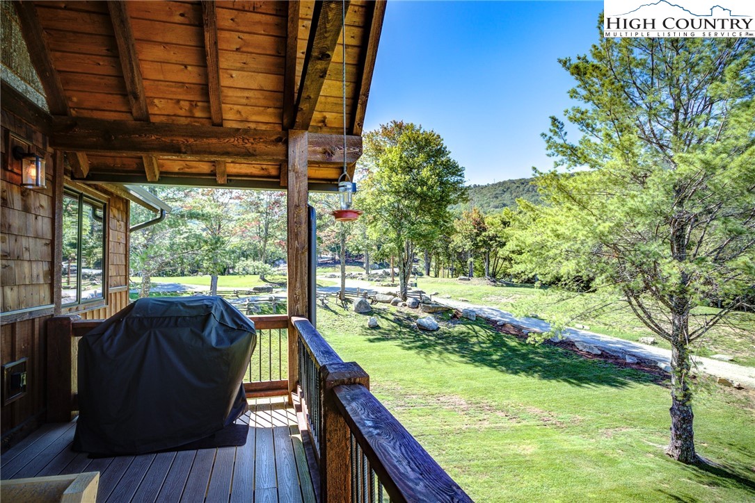 242 Camp Eagle Loop Banner Elk, NC 28604 - Photo 24 of 25 a view of balcony with couch and wooden fence