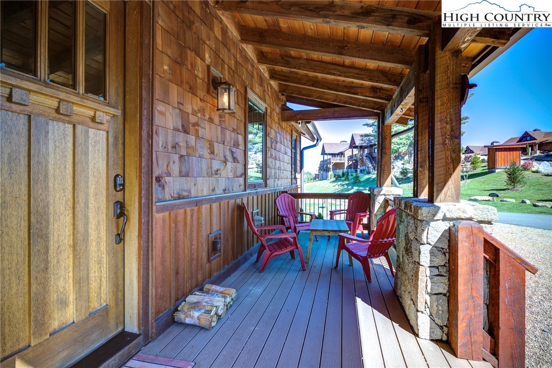 242 Camp Eagle Loop Banner Elk, NC 28604 - Photo 6 of 25 a view of a chairs on the deck